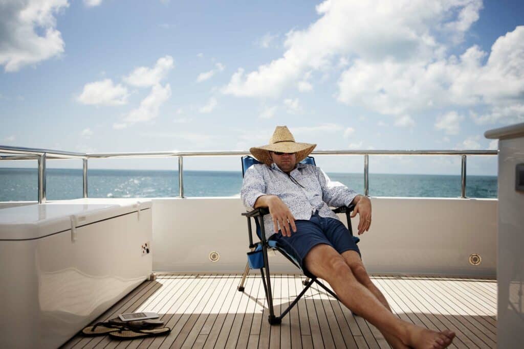 man relaxing on yacht N4MX3FD